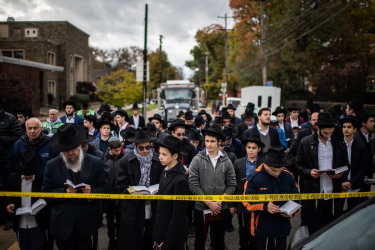 Yeshiva High School students pray at a memorial in front of Tree of Life synagogue in Pittsburgh on Oct. 29. 