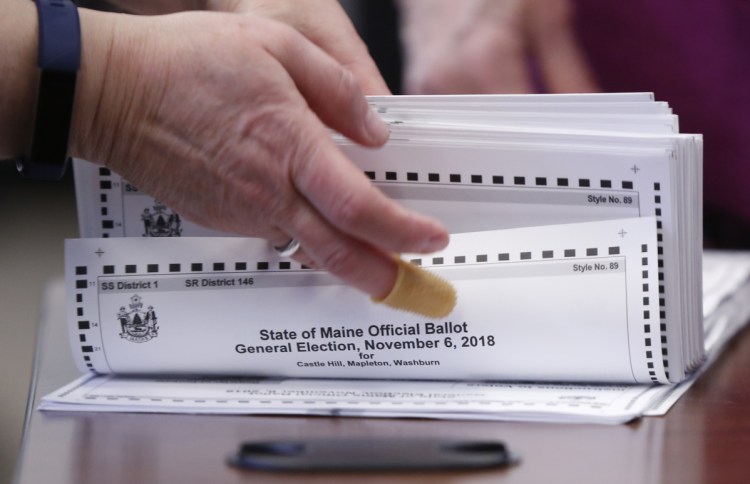 Ballots are prepped for a 2nd District ranked-choice count. 