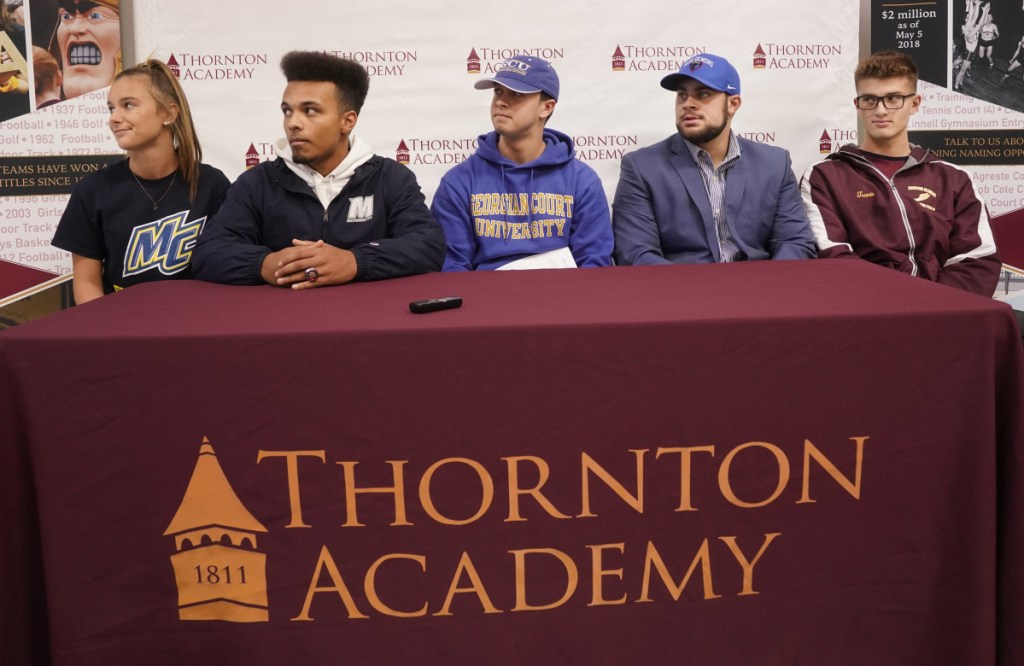 SACO, ME - NOVEMBER 14: Catherine Henaire, Craig LaBreck, Thomas Levasseur, Jason Montano and Travis Snyder, left to right, all signed letters of intent at Thornton Academy on Wednesday to attend NCAA Division I and II schools. Henaire will play field hockey at Merrimack College, LaBreck will play lacrosse at Monmouth University, Levasseur will play lacrosse at Georgian Court University, Montano will compete in track and field for DePaul University and Snyder will compete in track and field for the University of Connecticut. (Staff photo by Gregory Rec/Staff Photographer)