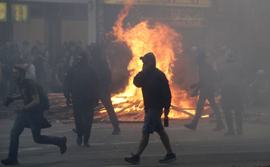 A fire burns on a street in Hamburg, Germany, last year as protesters confront police during a G-20 summit. Argentina is preparing for similar protests during a summit that begins Friday.