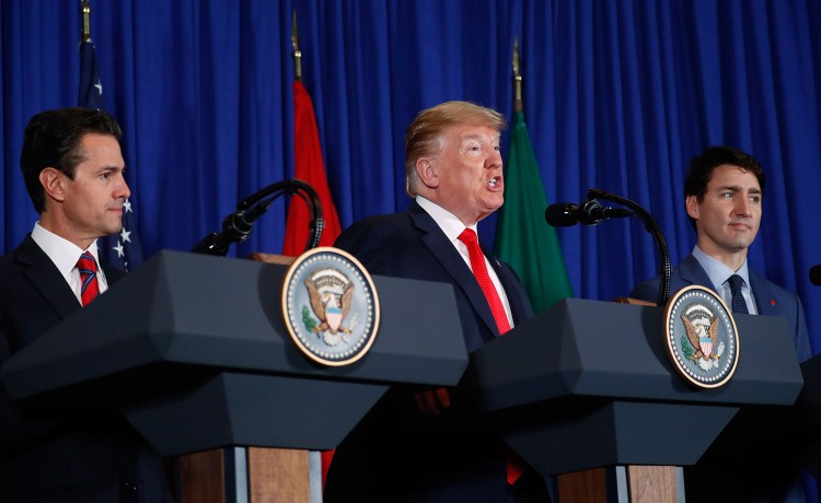 President Trump speaks during the signing ceremony for a new three-nation trade pact with Canada's Prime Minister Justin Trudeau, right, and Mexico's President Enrique Pena Neto, left, on Friday in Buenos Aires, Argentina.