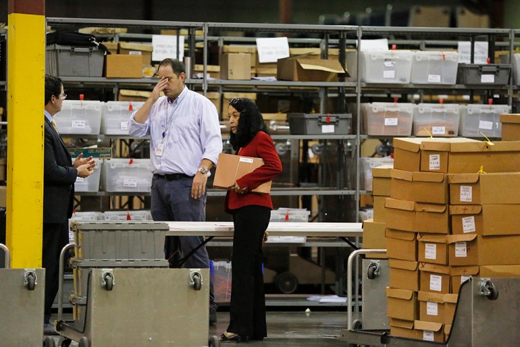 Susan Bucher, Supervisor of Elections speak to the elections office workers at the Palm Beach County Supervisor of Elections office during a recount on Wednesday.