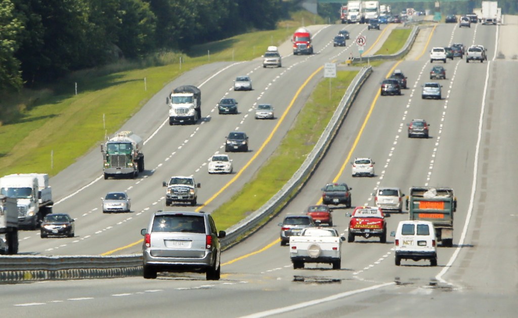 The little boy in the back seat, not the sign on the highway, told her she was home.