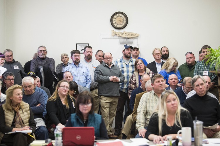 Douglas LaCroix of Skowhegan listens to comments made to Somerset County commissioners Wednesday about the pros and cons of the proposed 145-mile CMP power line through parts of Somerset County.