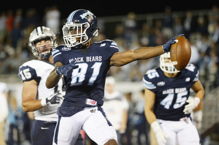 ORONO, ME - AUGUST 30: Maine's Earnest Edwards stretches for the goal line as he scores a touchdown against New Hampshire Thursday, August 30, 2018. (Staff photo by Shawn Patrick Ouellette/Staff Photographer)