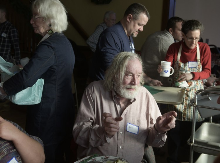 Bill Caldwell of Farmingdale speaks with a fellow guest at the South Parish Congregational Church Augusta on Tuesday.