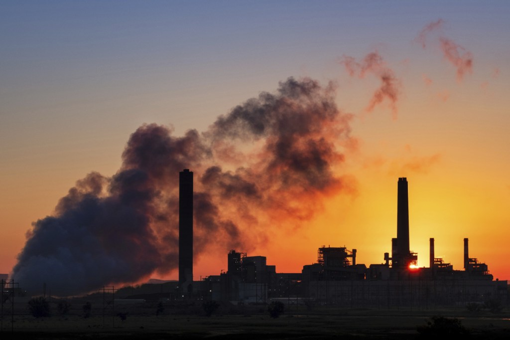 The Dave Johnson coal-fired power plant spews in Glenrock, Wyo. The EPA is revisiting a 2011 rule limiting mercury emissions from coal plants.