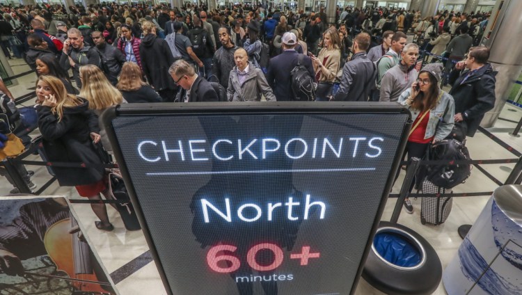 Security lines at Hartsfield-Jackson International Airport in Atlanta stretch more than an hour long amid the partial federal shutdown, causing some travelers to miss flights on Monday. The long lines signaled staffing shortages at security checkpoints, as TSA officers have been working without pay since the federal shutdown began Dec. 22.