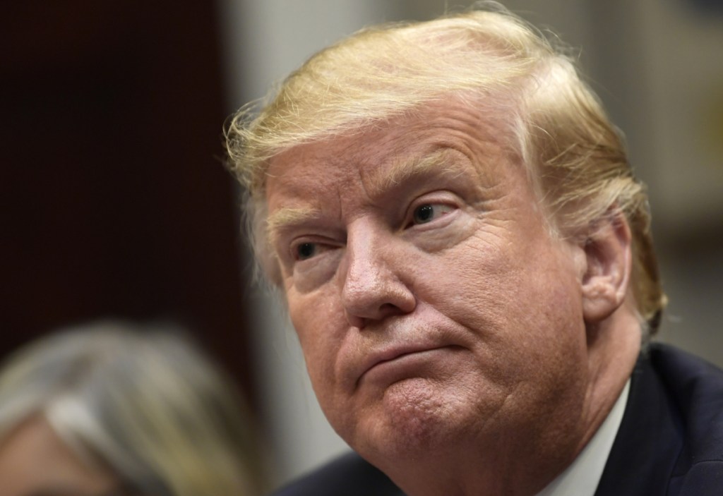 President Trump listens during a meeting with Hispanic pastors in the Roosevelt Room of the White House on Friday. Chief of staff Mick Mulvaney, left, says Trump is prepared for another government shutdown if necessary.