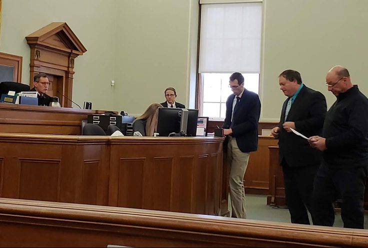 Brandon Luzzi, far right, in Knox County Superior Court on Wednesday. From left, Justice Bruce Mallonee, court security supervisor Jenn Daniels, Deputy District Attorney Jeffrey Baroody, defense attorney Michael Harman, and Luzzi. 