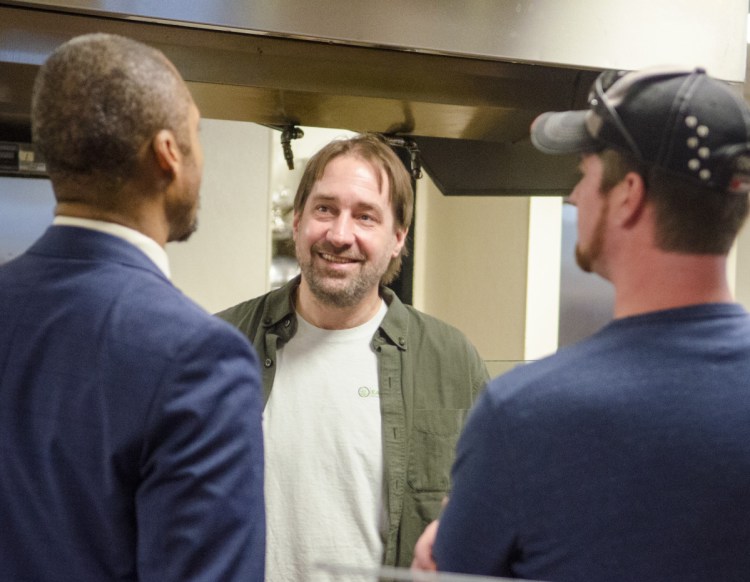 Committee On Agriculture Conservation and Forestry co-chair Rep. Craig Hickman, D-Winthrop, left, Dawson Julia, owner of East Coast CBDs in Unity, and Gary Runnells, owner of Nature Pressed Infusions in Newport, talk about the future of CBDs in Maine on Tuesday February 5, 2019 in cafeteria of the Burton M. Cross in Augusta. Dozens of advocates were in at the State House to lobby for open access to the cannabis-derived product. (Staff photo by Joe Phelan/Staff Photographer)