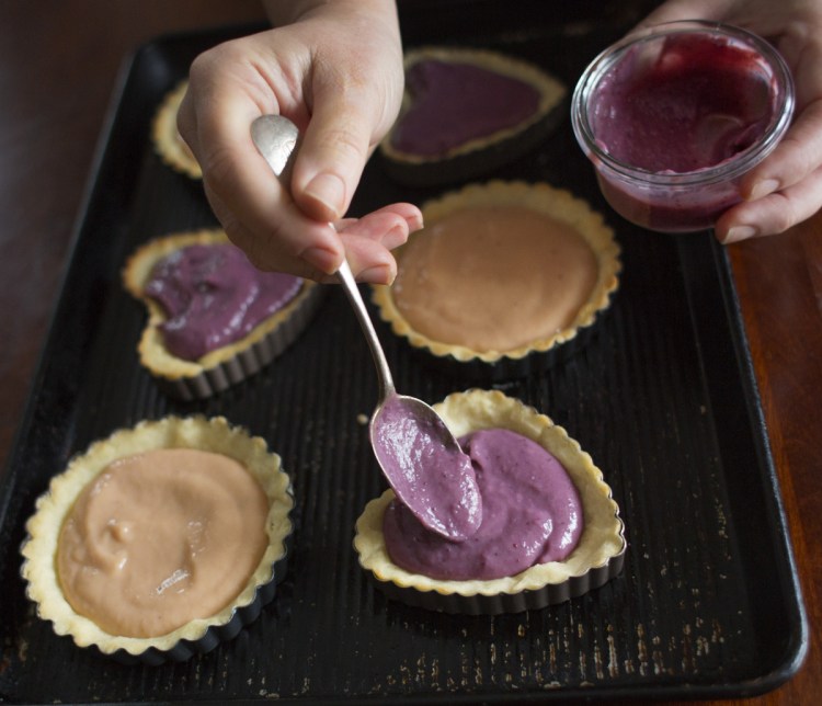 Christine Burns Rudalevige fills tart molds with frozen fruit curds.