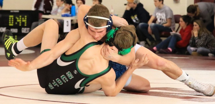 Zach Elowitch of Portland/South Portland battles with Morrison Doucette of Bonny Eagle during a 160-pound semifinal in the Class A South regional. Elowitch went on to win his weight class.