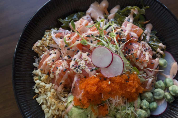 The salmon poké at Crunchy Poké Bar in Portland is topped with a creamy Japanese-mayonnaise sauce and brilliant orange masago (capelin roe).