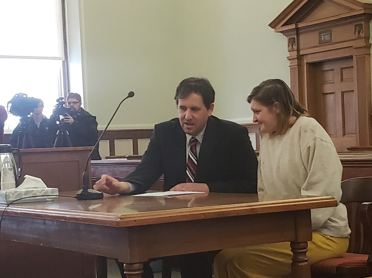 Sarah Richards listens to her attorney Jeremy Pratt prior to the start of her initial court hearing Monday in Knox County Superior Court on Monday, Feb. 25, 2019.