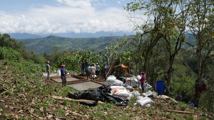 With community assistance, the Portland EWB team pours tank pads for the new water system in El Progreso, Ecuador. At far left is Lina Juozelskis of Haley & Aldrich. Conversing are Helena Hollauer, left, of  Envirotech Associates, and Julianne Page of Woodard & Curran.