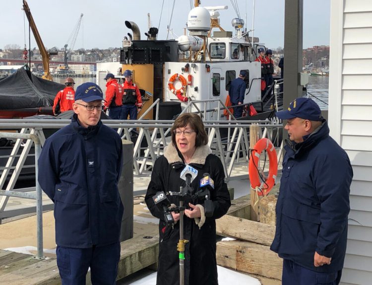 Sen. Susan Collins talks to reporters Wednesday after a ribbon-cutting ceremony for a renovated command center at the U.S. Coast Guard station in South Portland. Collins was joined by Rear Adm. Andrew Tiongson, right, and Sector Northern New England Commander Capt. Brian LeFebvre.