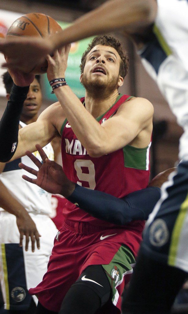 R.J. Hunter of the Maine Red Claws looks for room Thursday night. Maine beat Iowa 110-102 at the Portland Expo.