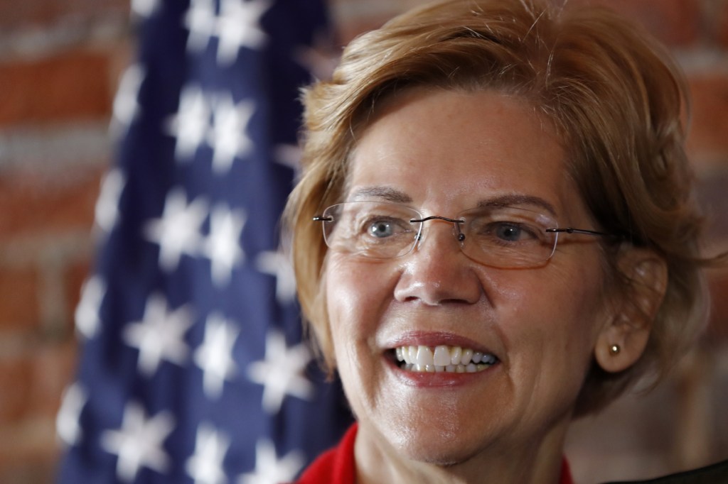 Sen. Elizabeth Warren, D-Mass., a 2020 presidential candidate, speaks to local residents during an organizing event Friday in Dubuque, Iowa.