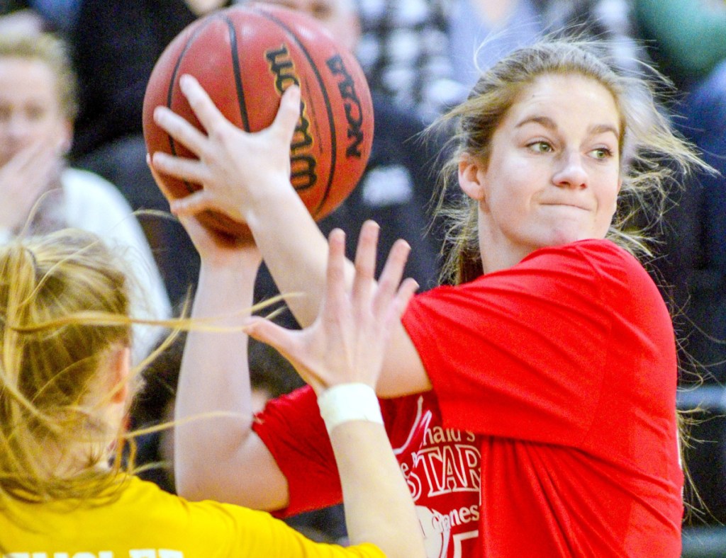 Sydney Ames of Skowhegan is defended by Greely's Anna DeWolfe during the Class AA/A/B girls' McDonald's All-Star Game on Saturday at Husson University.