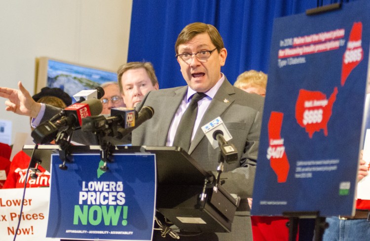 Senate President Troy Jackson, D-Allagash, speaks during a news conference about the cost of prescription drugs on Tuesday in the Maine State House's Hall of Flags in Augusta.