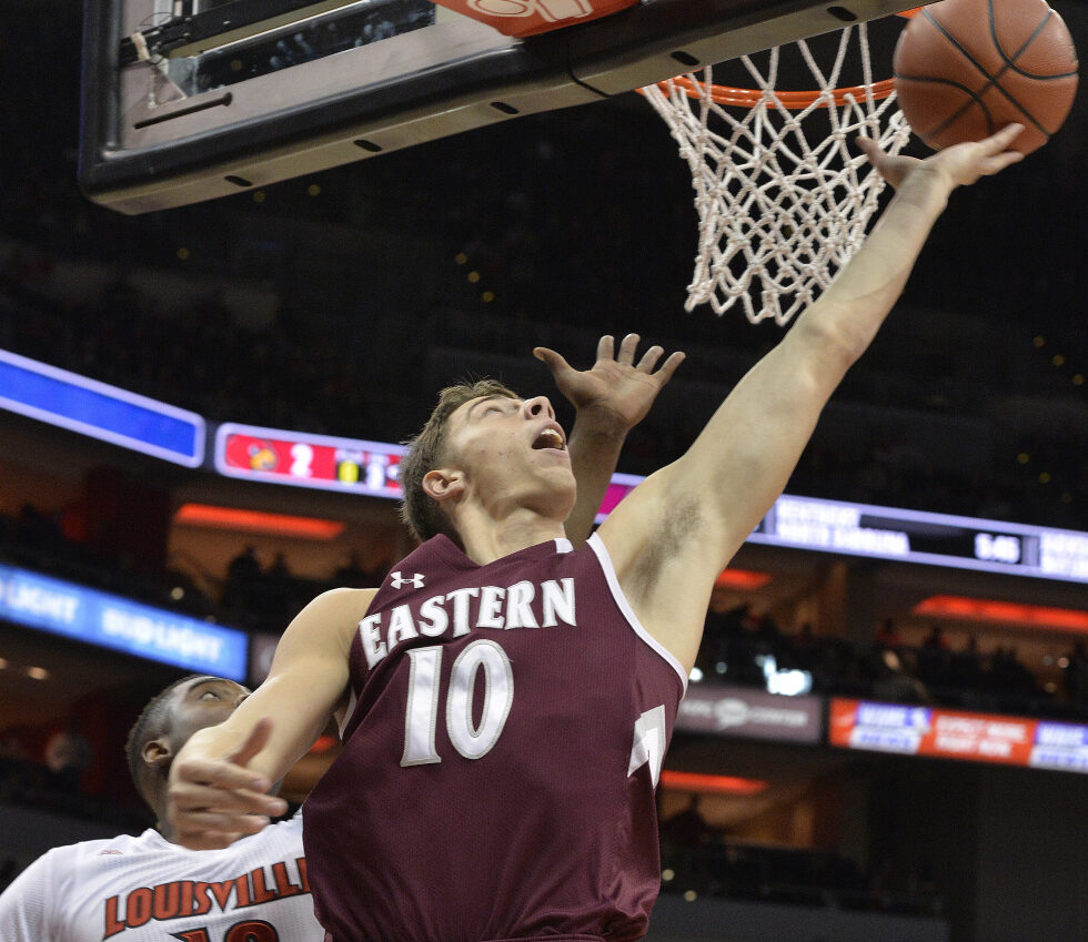 Eastern Kentucky's Nick Mayo (10) shoots past the defense of Louisville's Jaylen Johnson (10) during the first half of an NCAA college basketball game, Saturday, Dec. 17, 2016, in Louisville, Ky. (AP Photo/Timothy D. Easley)