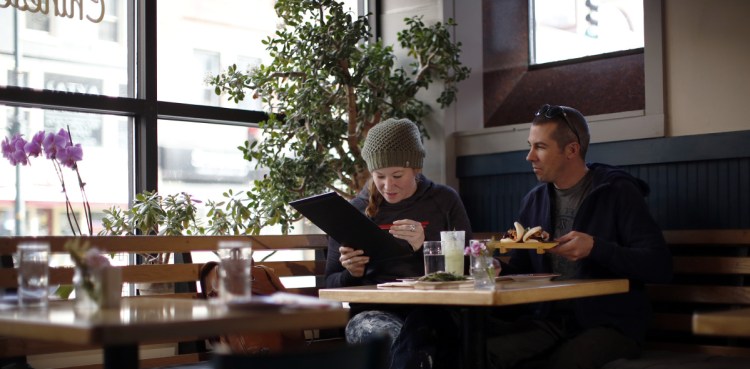 Jessie Sterling and Matt Melcher prepare to dig into a late lunch at Empire.