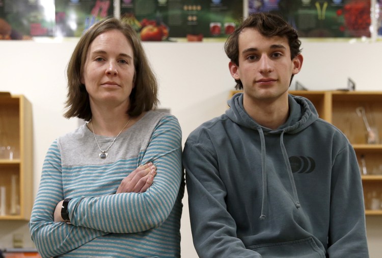 Matt Hogenauer, with Falmouth High School science teacher Amy Magnuson, says he contracted pertussis two weeks ago.