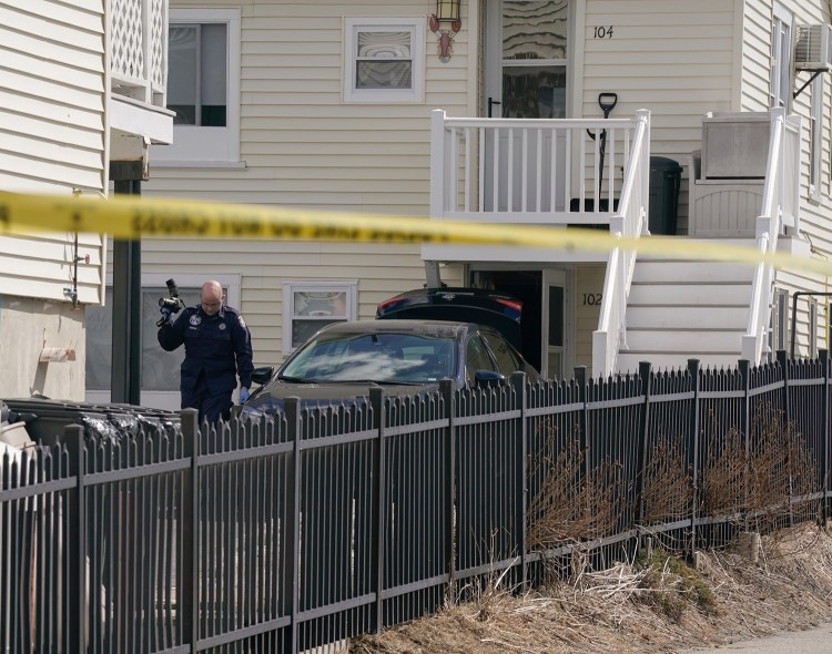 A Maine State Police investigator works at the scene of William Popplewell's death near 5 Boisvert St. in Old Orchard Beach on Tuesday. 