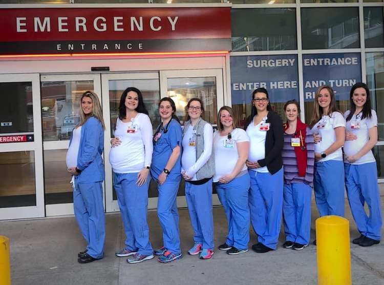 Some of the women who are pregnant and work in Maine Medical Center's Emergency Department gather outside. 