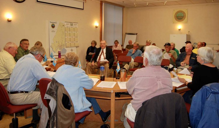 Thomaston attorney Paul Gibbons, seated center facing camera, is shown with the Board of Selectmen at a public hearing in 2018.