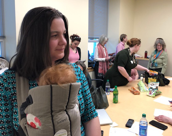 Deirdre Fulton and her 5-month-old daughter, Roz, listen to testimony Wednesday at the state capital complex in Augusta on a bill that proposes to use state tax funds to pay for abortions for Medicaid enrollees. Fulton is communications director for Maine Family Planning and the women behind her are also supporters of abortion rights.

