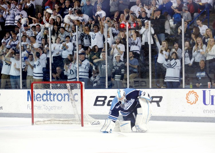 Rob McGovern of Maine reacts after giving up a goal to Tyler Kelleher of New Hampshire in a 2016 game. The University of Maine, once a Hockey East power, hasn't made it to the NCAA tournament since 2012.