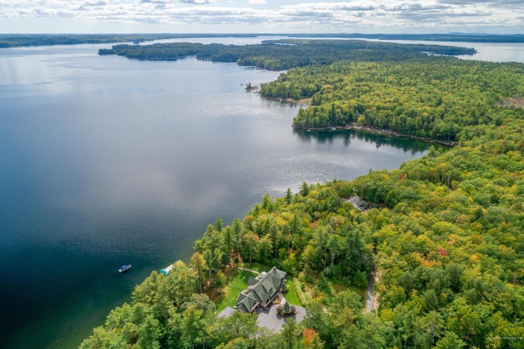 An aerial photograph of 58 Mystic Cove Rd. in Raymond. With 5 bedrooms and 52+ acres, this was one of the state's largest closings in 2020.