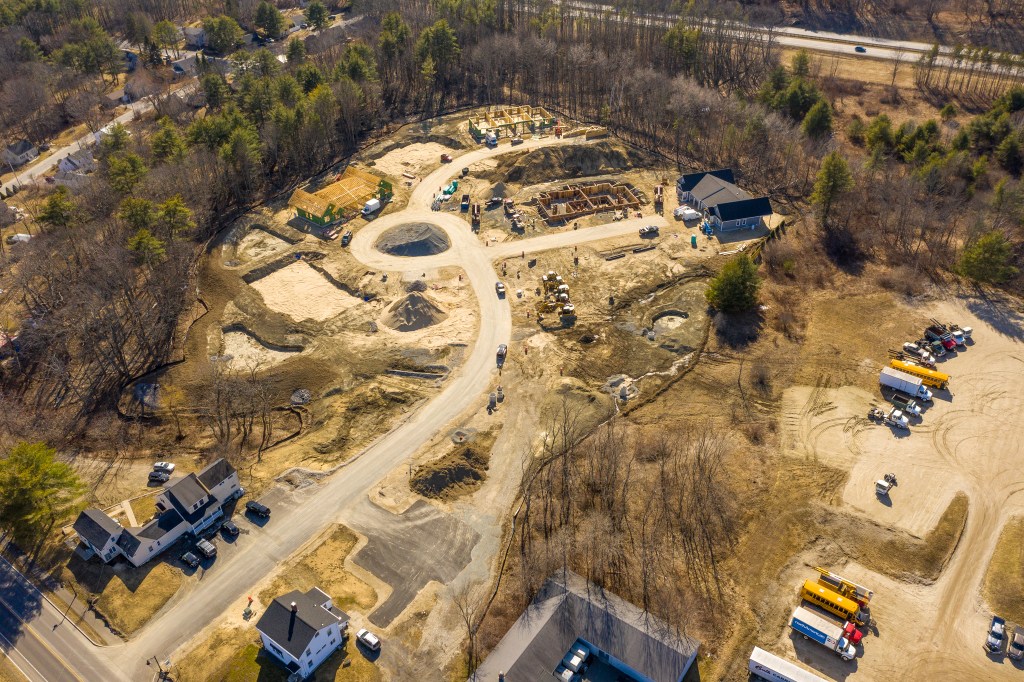 Aerial view of a construction site for Clover Way, a subdivision in West Falmouth