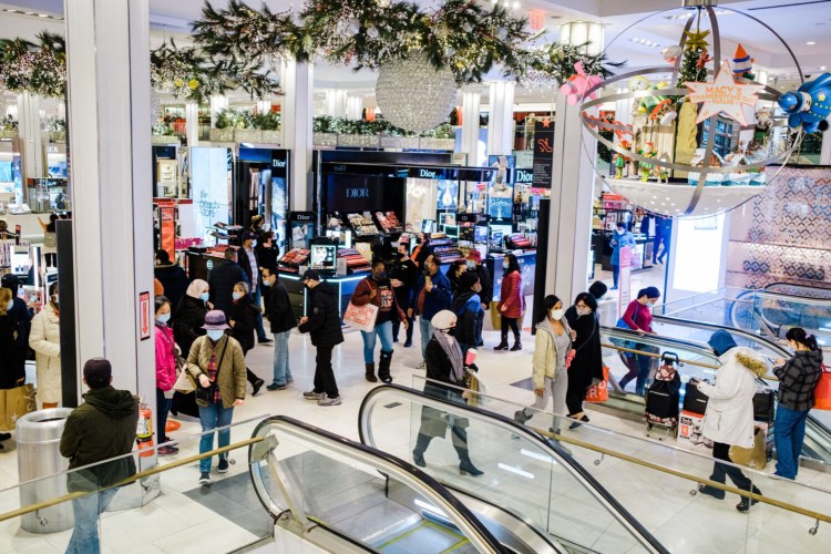 Shoppers walk through Macy's flagship store in the Herald Square area of New York on Nov. 27, 2020. MUST CREDIT: Bloomberg photo by Gabriela Bhaskar.