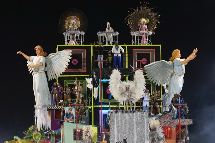 Dancers from the Unidos da Vila Maria samba school perform on a float during a carnival parade in Sao Paulo, Brazil, on Saturday. 