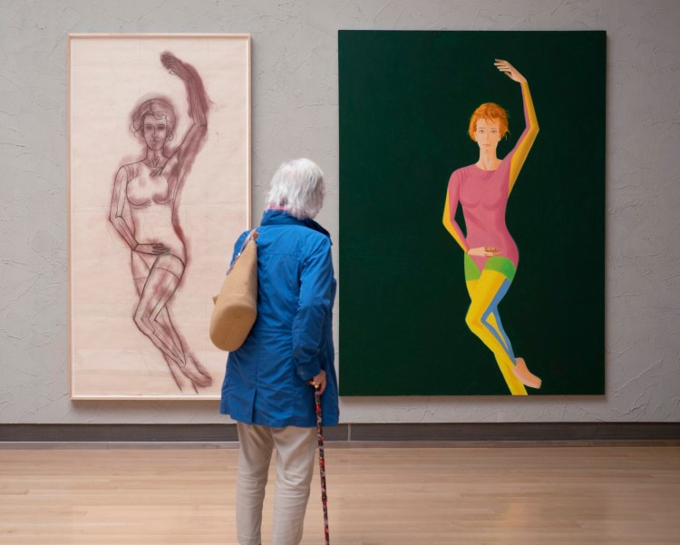 ML Riley takes in "Cartoon Drawing of Junction," left, and the painting "Junction" at the Colby Museum of Art