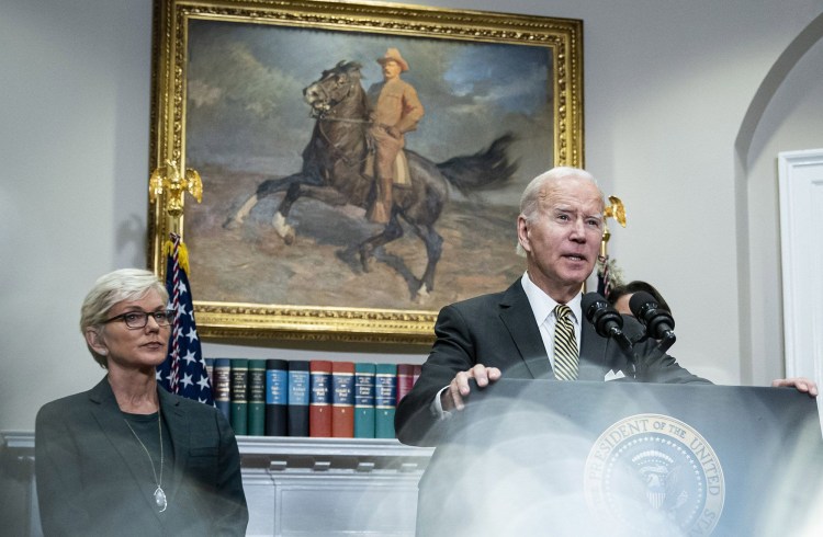 President Joe Biden speaks as Jennifer Granholm, U.S. energy secretary, left, and Brian Deese, director of the National Economic Council, right, listen in the Roosevelt Room of the White House in Washington, D.C. MUSST CREDIT: Bloomberg photo by Al Drago.