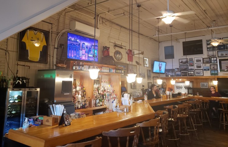 The bar during a lull at Andy's Old Port Pub. The pub is under new ownership. Among other changes, it's now soccer-focused. 